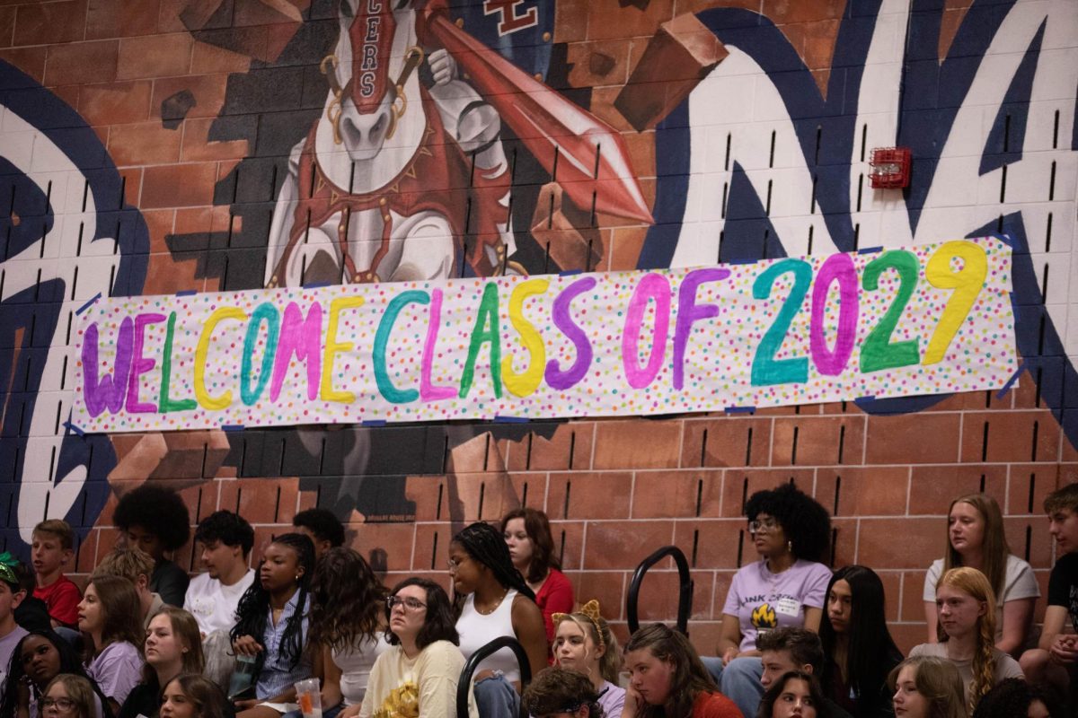 Freshmen seated in the gym for orientation on the first day of school, anticipating the start of the year. Image by Elliana MacLean. 