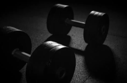 Photo of two weights on the ground. Photo from Canva.com.