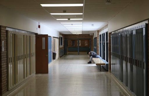 A student sits in a school hallway. Photo courtesy of Unsplash.com.
