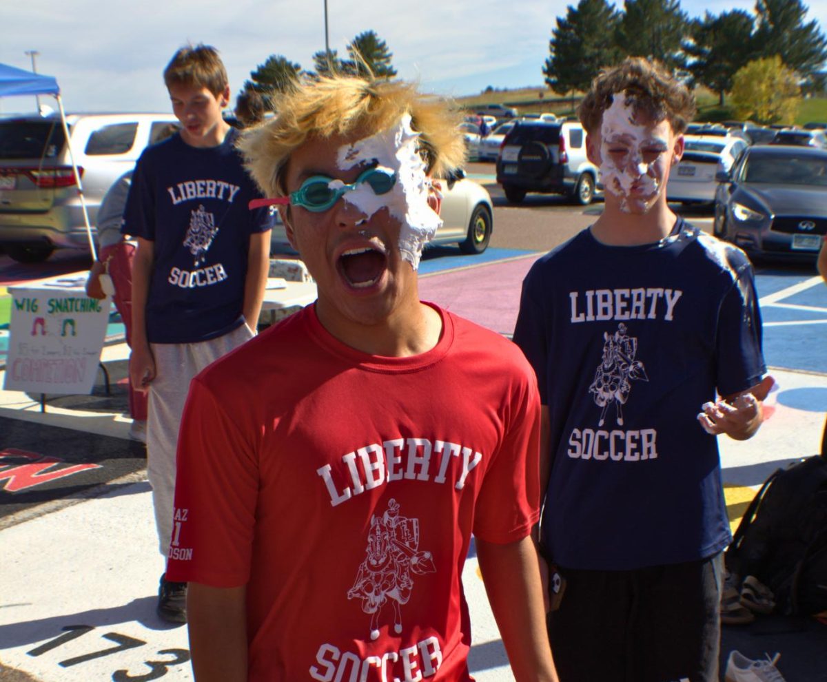 Freshman Rilo Smith after getting pied in the face by a teammate. 