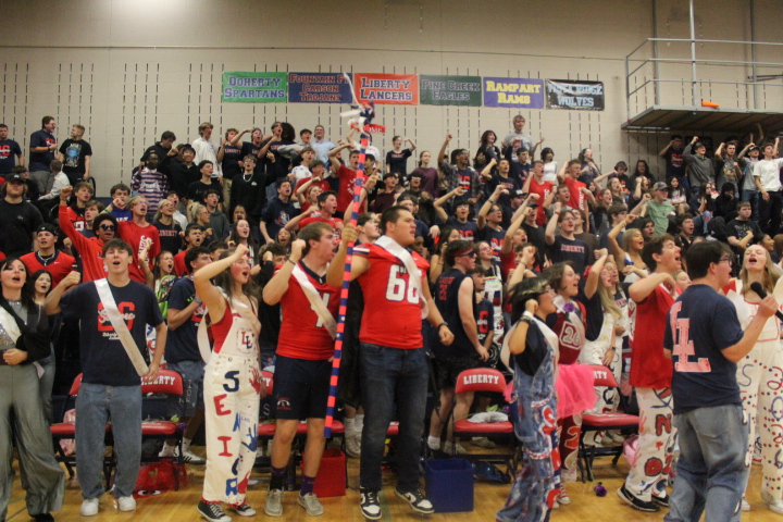 Liberty students doing the schools "Party" cheer at the Homecoming Assemble. Photo by Morgan Dalton.