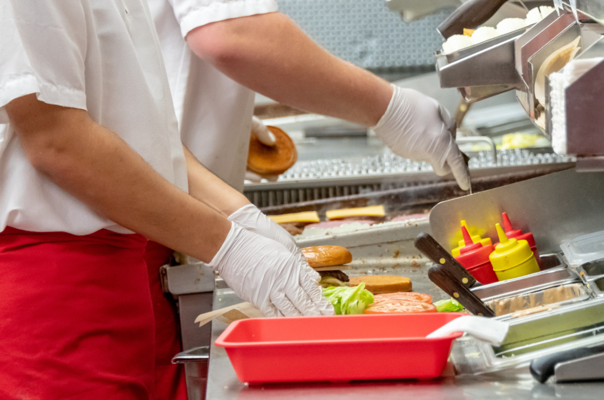 Teen working a fast-food job. Photo from Canva.com.