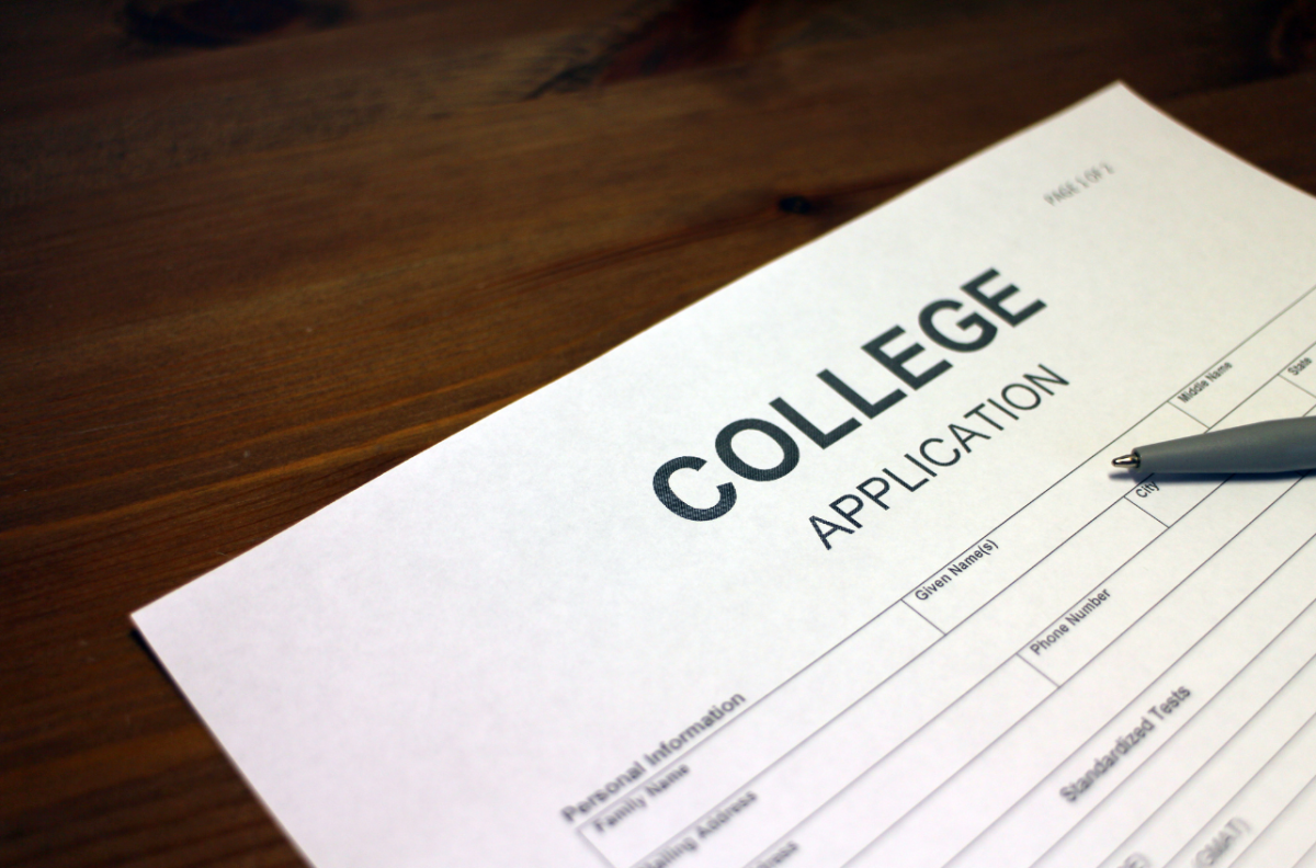 A college application paper on a desk. Photo from Canva.com.