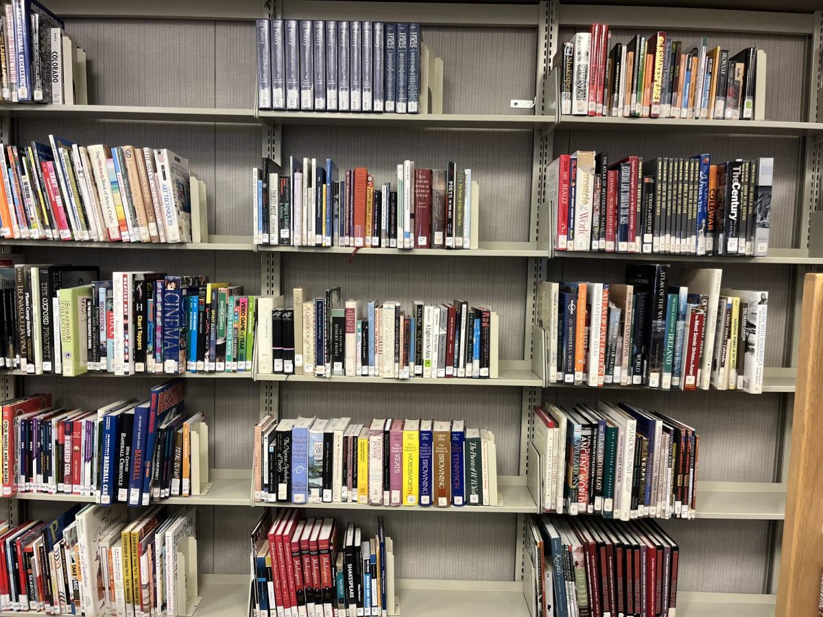 Books on a shelf in the Liberty High School library. Photo by Aspen Laslie.