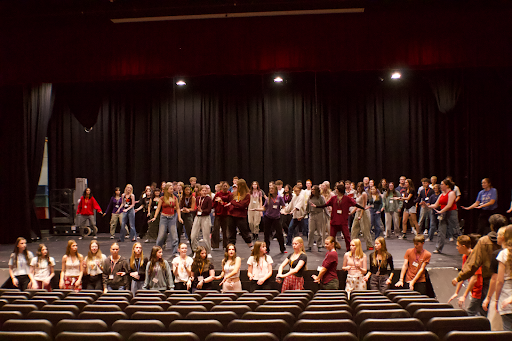 Students prepare in Scarborough Fair rehearsal. Photo by Harper Downey.