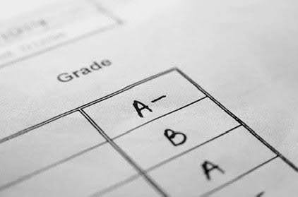 Spread sheet revealing different grades. Photo by Unsplash.