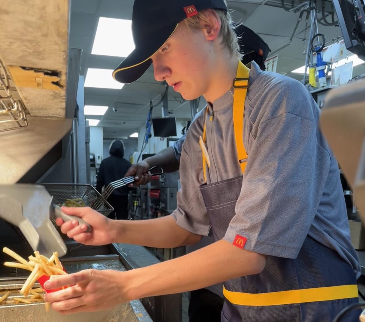 Junior Lucas Stuca working under pressure to meet deadlines. Photo by Ayden Myers.