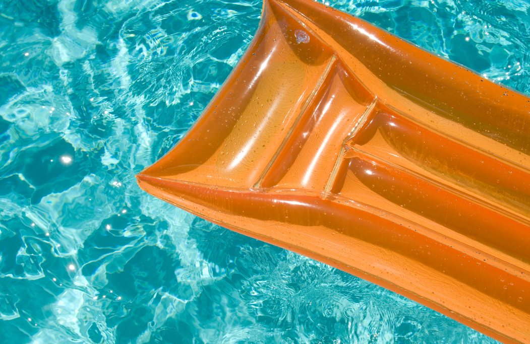 A pool raft in water. Photo by Canva.com.